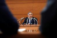 Bank of Japan (BOJ) Governor Haruhiko Kuroda attends a news conference at the BOJ headquarters in Tokyo