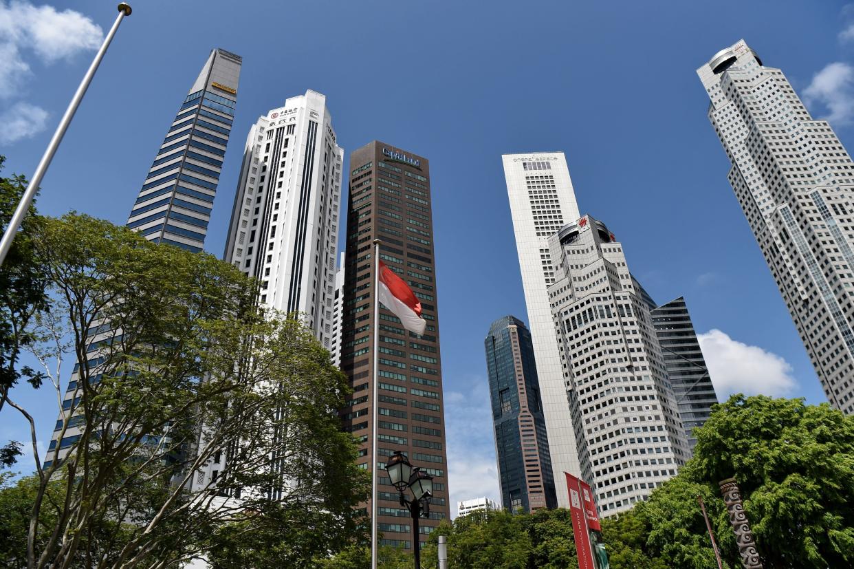 A general view of highrise office buildings at Raffles Place in Singapore on May 29, 2017. / AFP PHOTO / ROSLAN RAHMAN        (Photo credit should read ROSLAN RAHMAN/AFP/Getty Images)