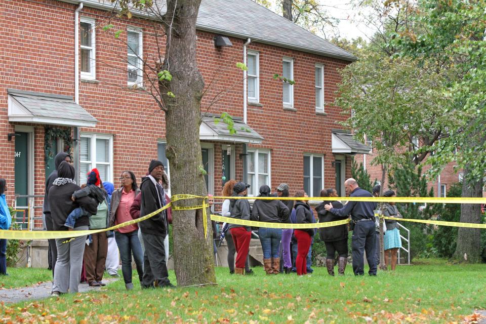 The scene after after a fatal shooting in October 2014 at the Chad Brown housing project in Providence.