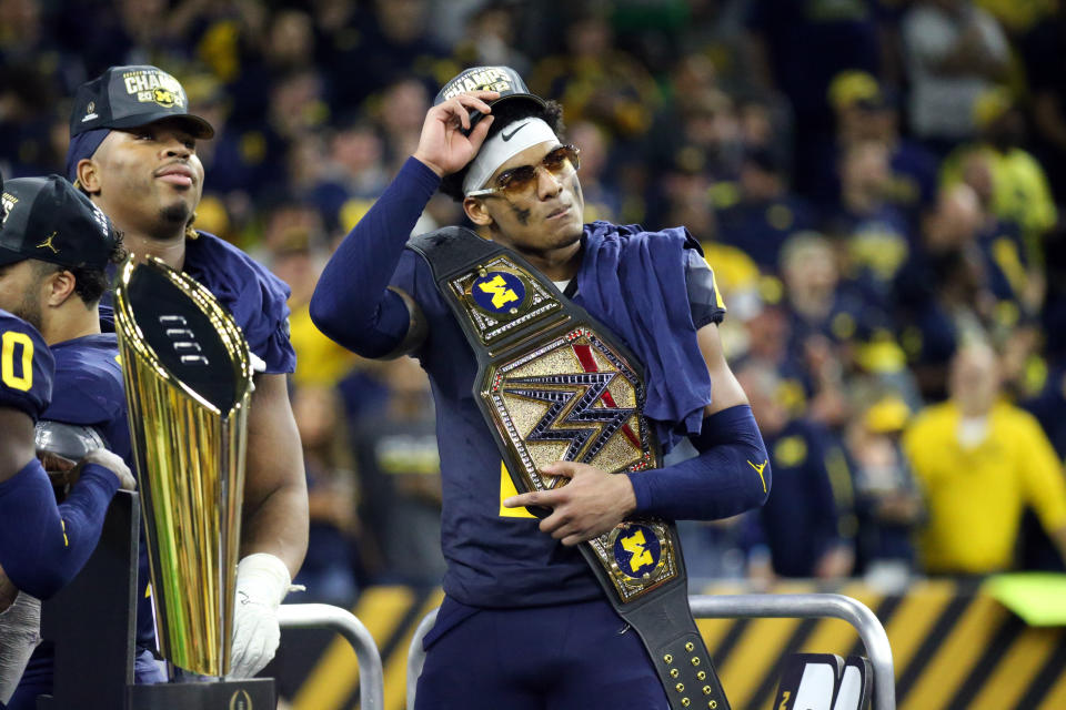 HOUSTON, TX - JANUARY 08: DB Will Johnson (2) of the Michigan Wolverines celebrates winning the game with a championship belt during the Michigan Wolverines versus the Washington Huskies CFP National Championship game on January 8, 2024, at NRG Stadium in Houston, TX. (Photo by Leslie Plaza Johnson/Icon Sportswire via Getty Images)