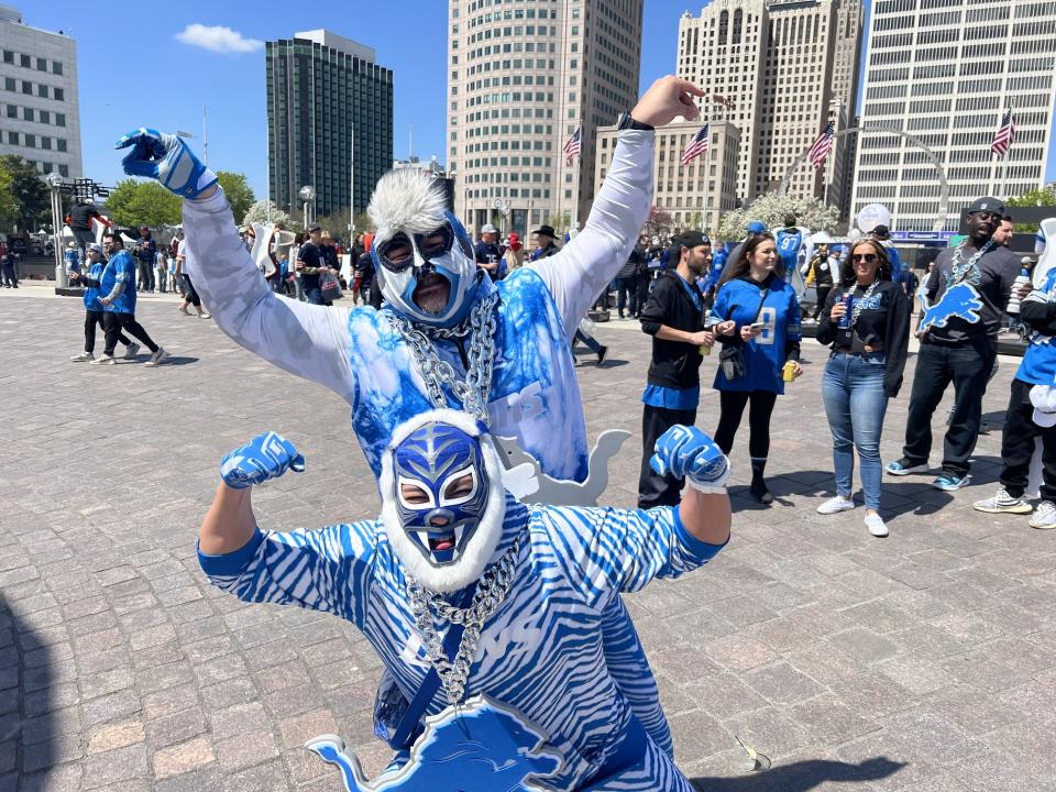 Reiner Calderero, 47, (front) and Chris Guiao, 41, couldn't wait to visit the NFL Draft Experience at Hart Plaza early Thursday afternoon. They both said they're proud of the Lions' 2023 season, but equally amped about how well prepared the city appears for people coming to visit.