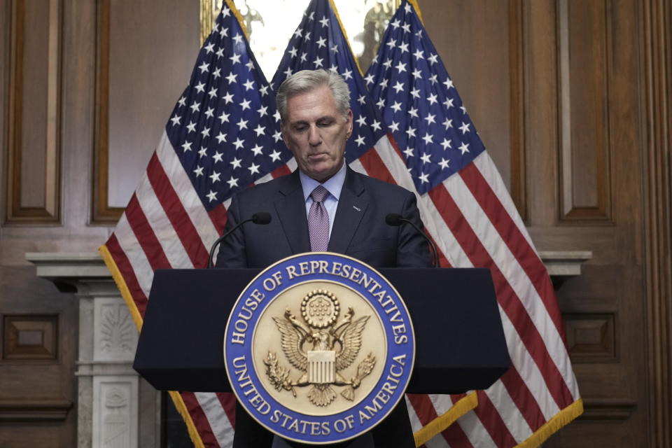 FILE - Rep. Kevin McCarthy, R-Calif., speaks to reporters hours after he was ousted as Speaker of the House, Tuesday, Oct. 3, 2023, at the Capitol in Washington. McCarthy says he's resigning from his congressional seat in California two months after his historic ouster as House speaker. (AP Photo/J. Scott Applewhite, File)