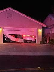 An allegedly stolen car being driven by a teen crashed through a residential garage in Victorville amid a police pursuit on Tuesday, May 14, 2024.