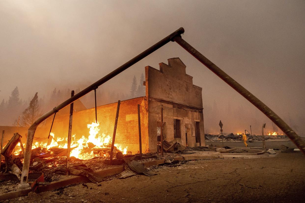 The Way Station bar burns as the Dixie Fire tears through the Greenville community of Plumas County, Calif. on Wednesday, Aug. 4, 2021.