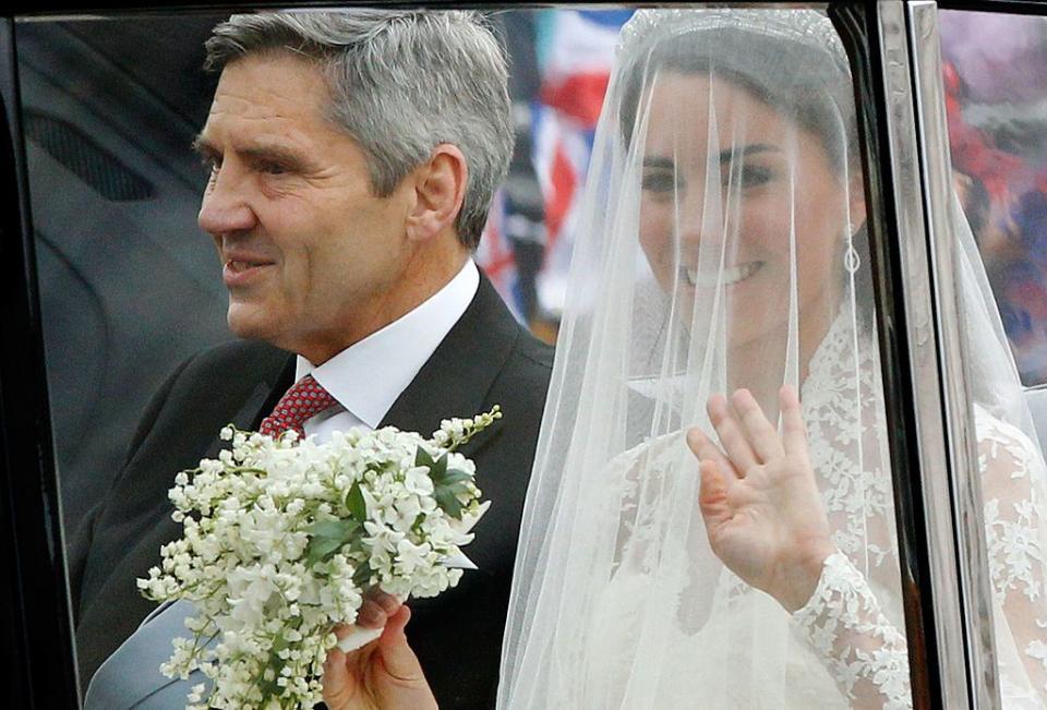 Kate's father walked her down the aisle.