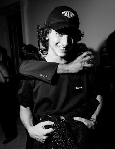 <p>Madison McGaw/BFA.com</p> Timothée Chalamet is all smiles with Haider Ackermann at the designer's NYFW event on Friday