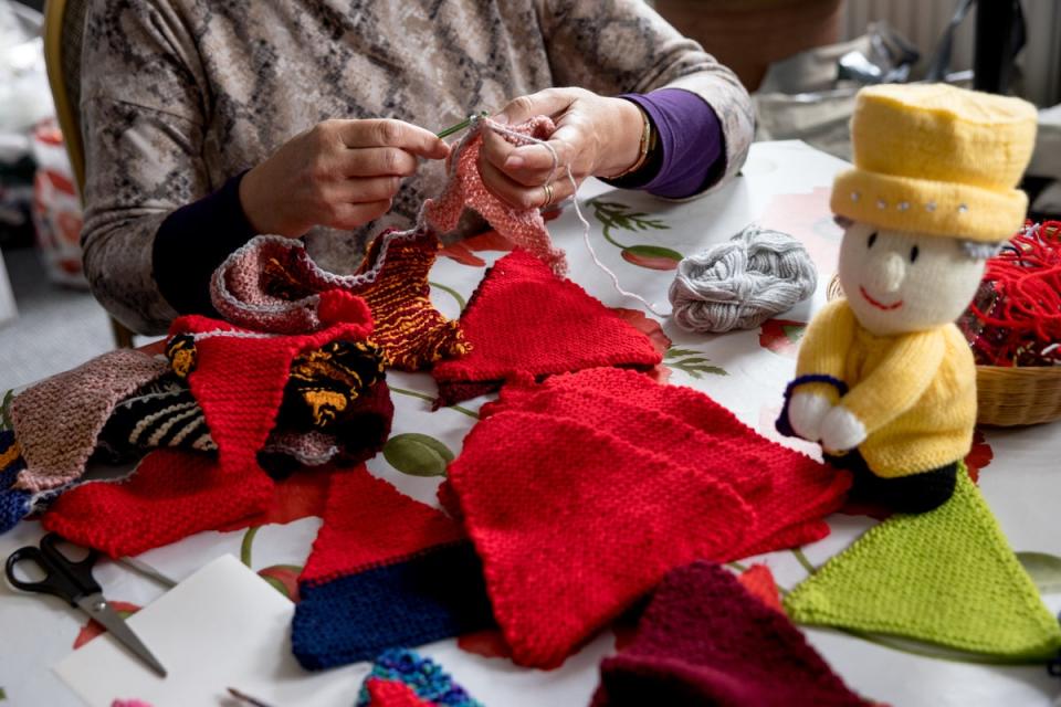 A knitter named Caroline Topping crocheting and knitting bunting for the Queen’s platinum jubilee in Beccles (Getty Images)