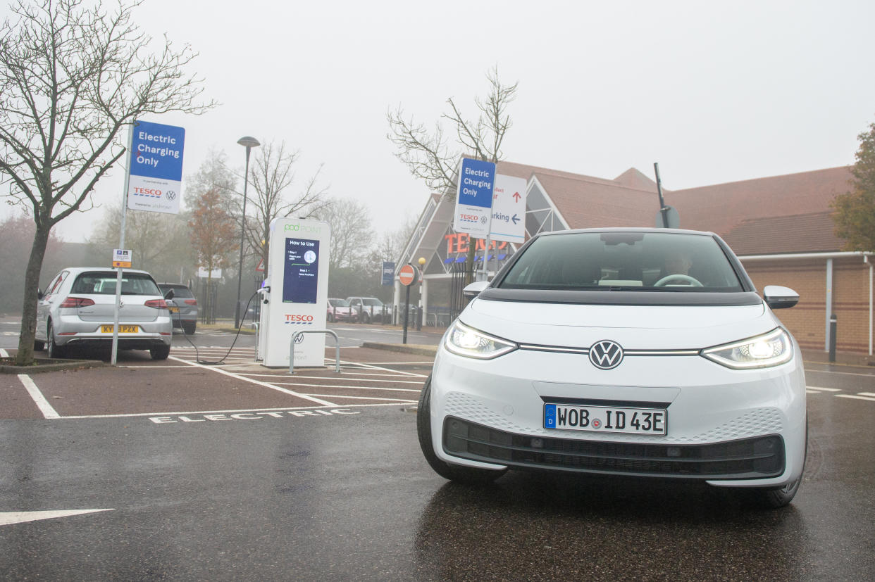 Electric VW ID3 car charging outside of Tesco