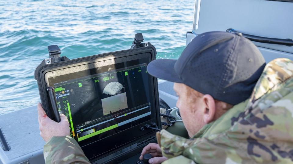 A sailor conducts a search for debris with an underwater vehicle during recovery efforts of a high-altitude balloon in the Atlantic Ocean, Feb. 7, 2023. (MCS1 Ryan Seelbach/Navy)