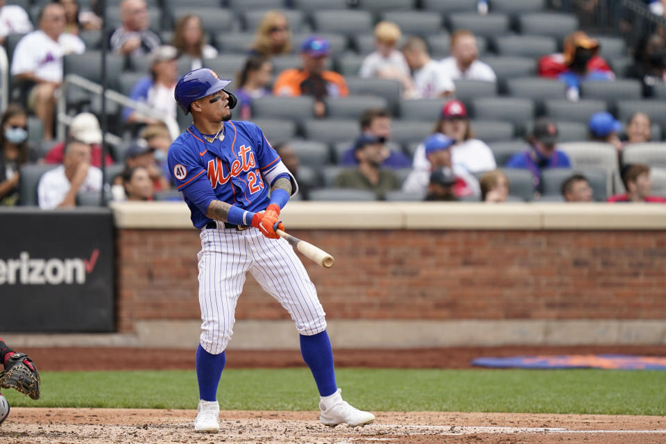 New York Mets' Javier Baez watches his two-run home run, also scoring Michael Conforto, during the fourth inning of a baseball game against the Washington Nationals, Sunday, Aug. 29, 2021, in New York. (AP Photo/Corey Sipkin)