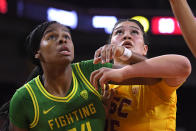 Oregon forward Ruthy Hebard, left, and Southern California forward Alissa Pili look for a rebound during the first half of an NCAA college basketball game Sunday, Feb. 16, 2020, in Los Angeles. (AP Photo/Mark J. Terrill)