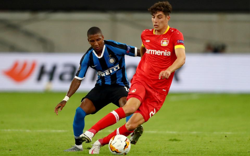 Kai Havertz is closed down by Ashley Young - GETTY IMAGES