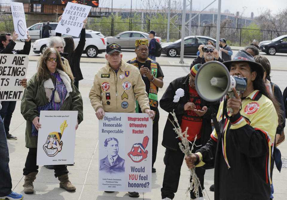 People protest before a baseball game between the Chicago White Sox and the Cleveland Indians, Tuesday, April 11, 2017, during opening day in Cleveland. (AP Photo/Tony Dejak)