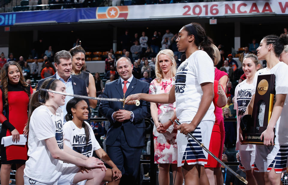 INDIANAPOLIS, IN - APRIL 05:  Breanna Stewart #30 and Moriah Jefferson #4 of the Connecticut Huskies are honored by teammate Morgan Tuck #3 of the Connecticut Huskies as head coach Geno Auriemma looks on after their 82-51 victory over the Syracuse Orange to win the 2016 NCAA Women's Final Four Basketball Championship at Bankers Life Fieldhouse on April 5, 2016 in Indianapolis, Indiana.  (Photo by Joe Robbins/Getty Images)