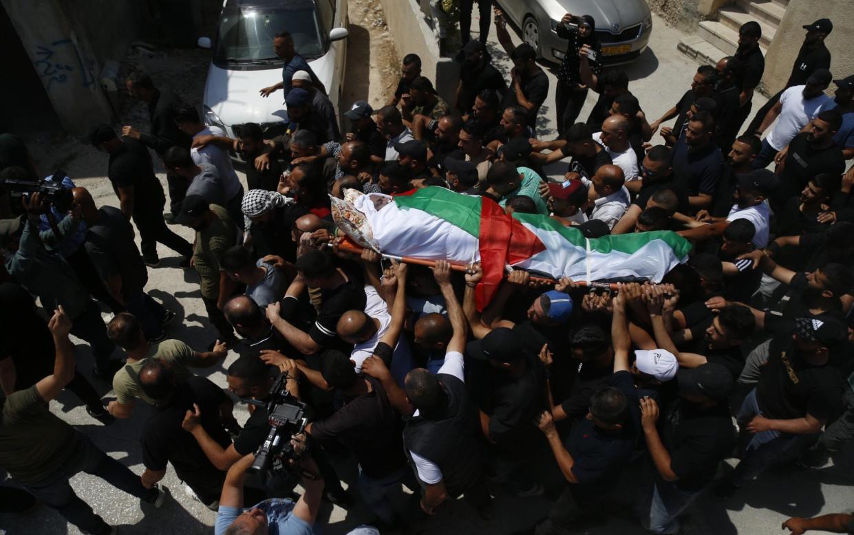 Palestinians attend the funeral for Khalil Ziada, who was killed in an attack by Jewish settlers on a Palestinian village in the West Bank