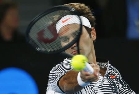 Tennis - Australian Open - Melbourne Park, Melbourne, Australia - 20/1/17 Switzerland's Roger Federer hits a shot for his Men's singles third round match against Czech Republic's Tomas Berdych. REUTERS/Edgar Su