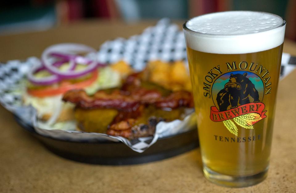 A Citra Session ale is served with the Smoky Burger and tater tots at Smoky Mountain Brewery in Turkey Creek Tuesday, March 31, 2015.