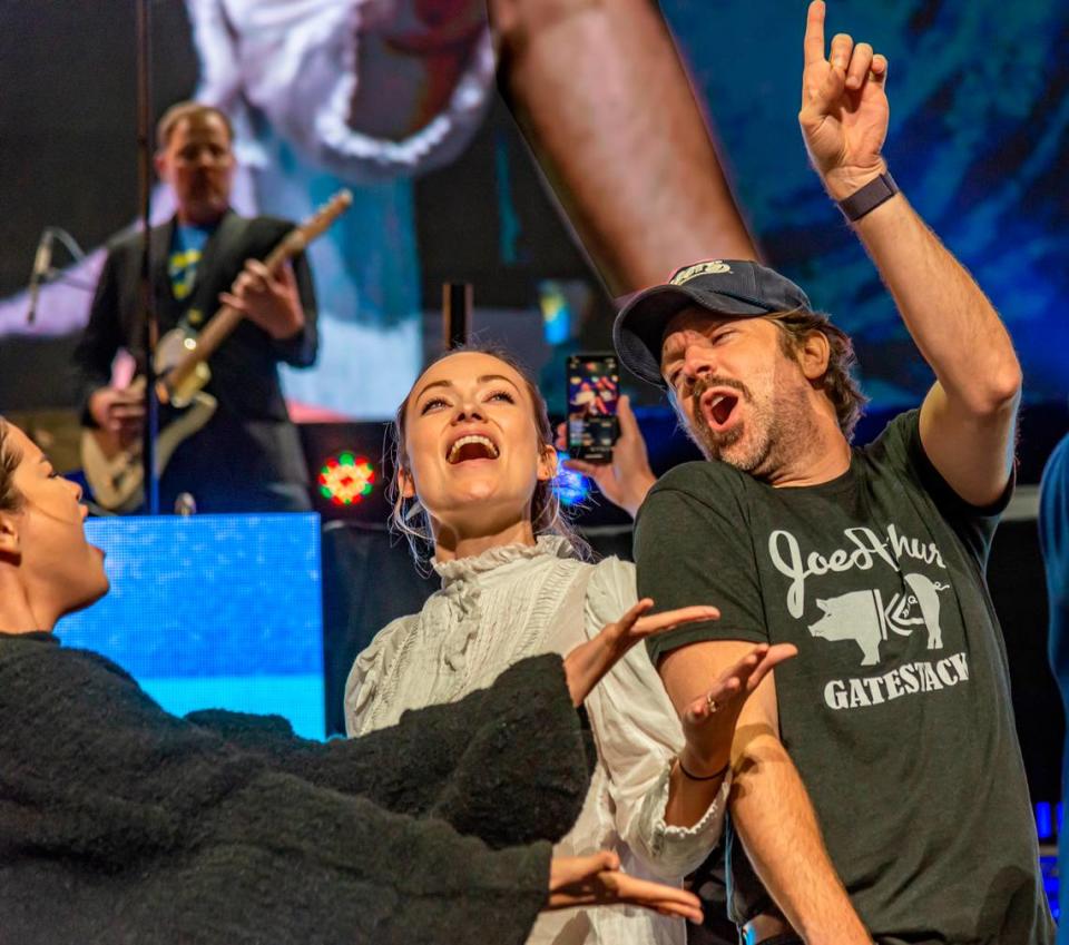 At the 2019 Big Slick Celebrity Weekend auction, Jason Sudeikis wore one of the first T-shirts his friend Brendan Curran created, honoring Kansas City barbecue. Sudeikis was joined onstage by Selena Gomez, left, and his then-fiancee, Olivia Wilde.