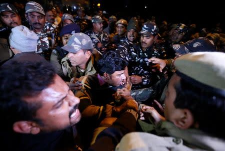 Protesters scuffle with police during a protest against state government for allowing two women to defy an ancient ban and enter the Sabarimala temple, in New Delhi, India, January 3, 2019. REUTERS/Adnan Abidi