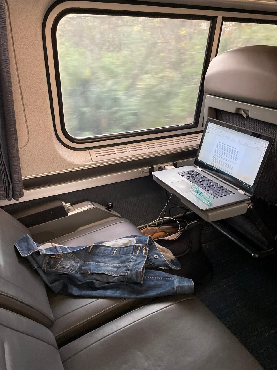 The window seat remote work set-up on an Amtrak train.