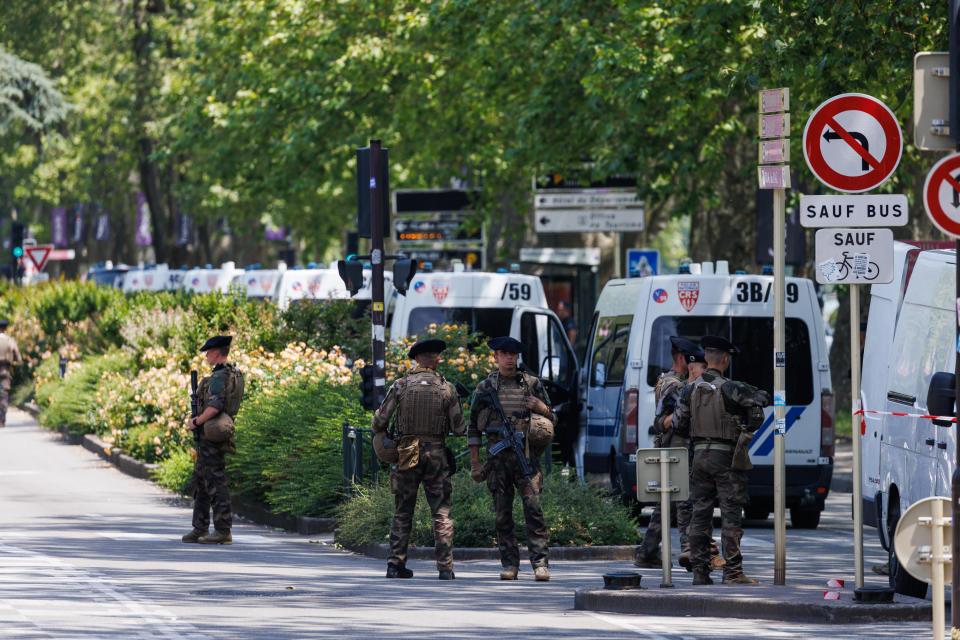 ANNECY, FRANCE - JUNE 08: Law enforcement stand near Paquier park where a man stabbed multiple people on June 8, 2023 in Annecy, France. Four children were among the victims in a knife attack in the southeastern French town of Annecy. (Photo by Richard Bord/Getty Images)