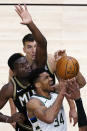 Milwaukee Bucks forward Giannis Antetokounmpo (34) drives to the basket as Atlanta Hawks center Clint Capela defends during the second half of an NBA basketball game Thursday, April 15, 2021, in Atlanta. (AP Photo/John Bazemore)