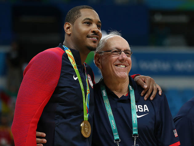 Carmelo Anthony and Jim Boeheim take in the gold. (Getty Images)