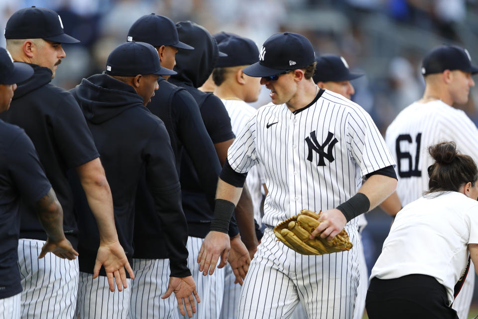 New York Yankees' Billy McKinney celebrates with teammates after defeating the Texas Rangers, Saturday, June 24, 2023, in New York. The Yankees won 1-0. (AP Photo/Noah K. Murray)