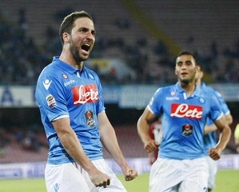 Napoli's Gonzalo Higuain celebrates after scoring during the Serie A match against AC Milan on May 3, 2015 at the San Paolo stadium