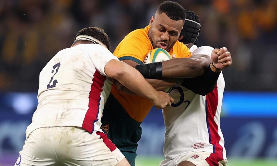 Samu Kerevi looks to power through a pair of England players in Perth