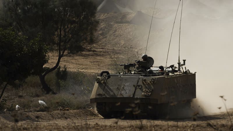An Israeli armored personnel carrier moves near the Gaza Strip border, in southern Israel on Tuesday, Oct. 31, 2023.