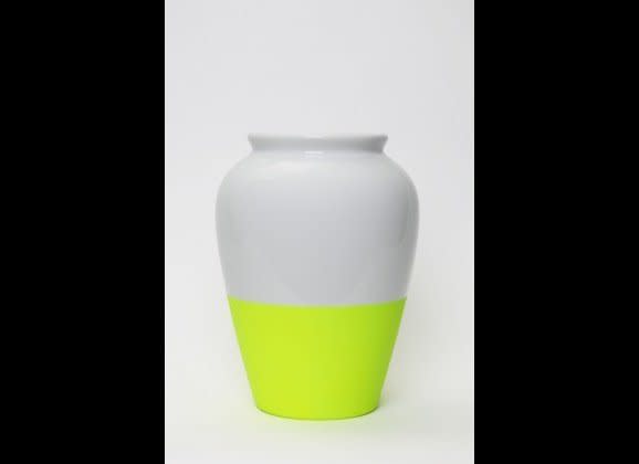 For an accent piece that really pops, try a <a href="http://www.huntingandcollecting.com/shop/1259-fluo-vase-yellow.html" target="_hplink">porcelain two-tone vase</a> with a bold fluorescent stripe.