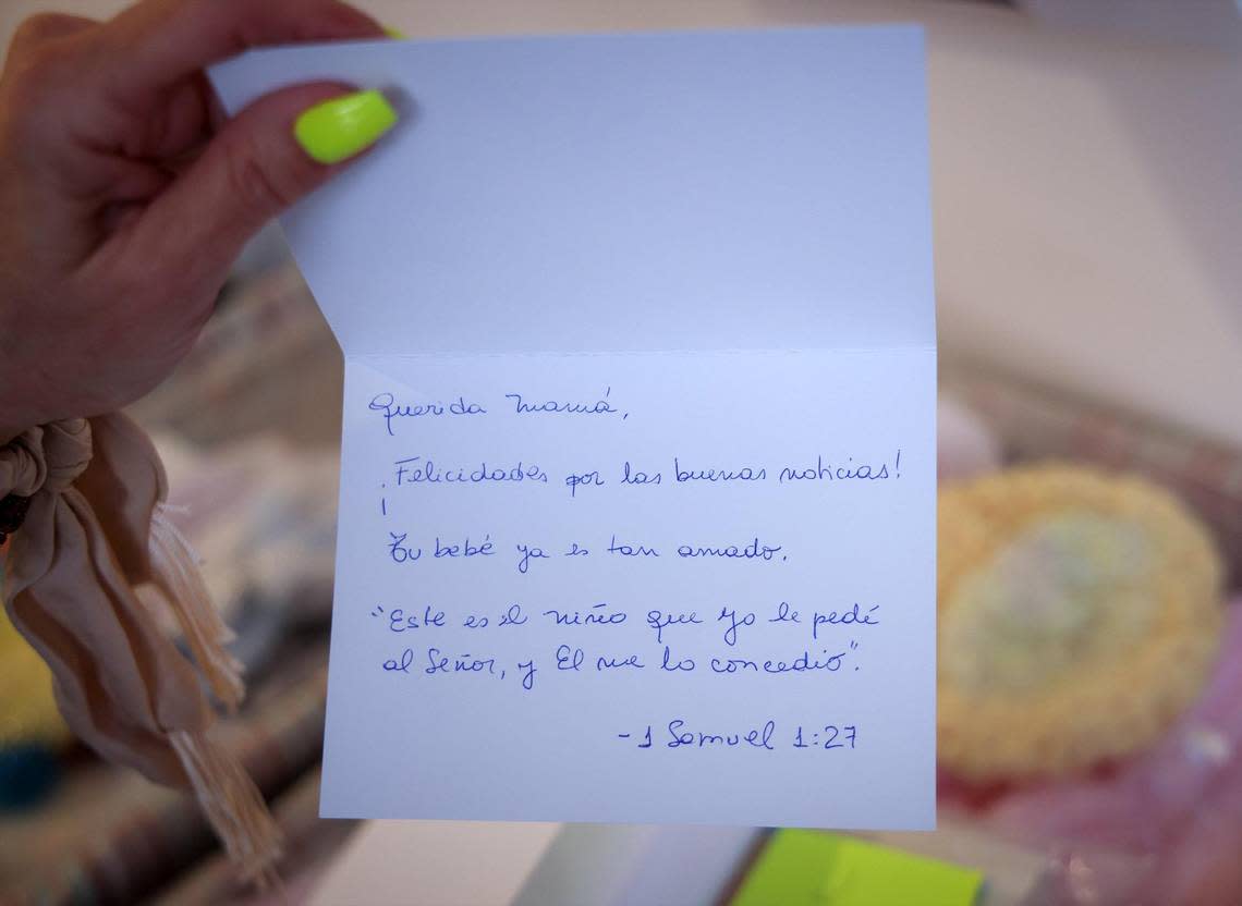 No matter if a woman is happy or sad about her pregnancy, congratulatory cards sometimes with Bible verses are placed inside the gift packages given to women who receive a positive pregnancy test at the pregnancy help center.