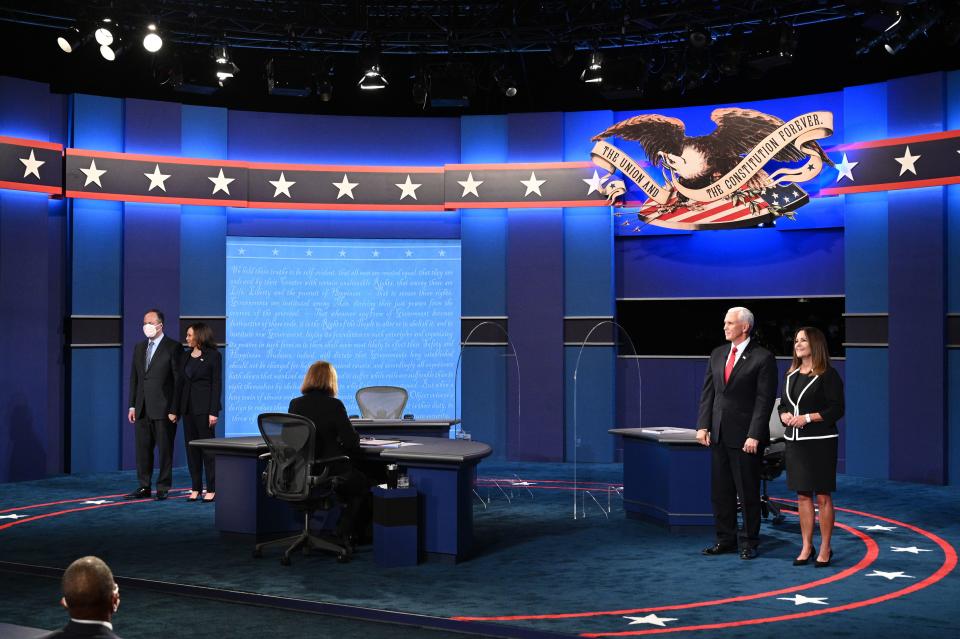 (From L) Husband of US Democratic vice presidential nominee and Senator from California, Kamala Harris, Douglas Emhoff, Harris, US Vice President Mike Pence Mike Pence and his wife Second Lady Karen Pence stand onstage after the vice presidential debate in Kingsbury Hall at the University of Utah on October 7, 2020, in Salt Lake City, Utah. (Photo by Robyn Beck / AFP) (Photo by ROBYN BECK/AFP via Getty Images)