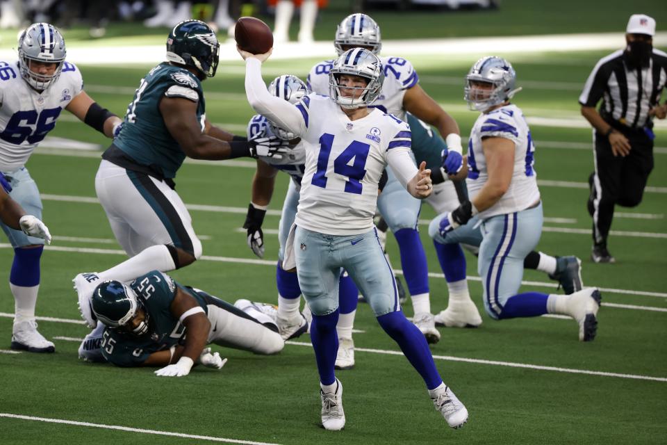 Dallas Cowboys quarterback Andy Dalton (14) scrambles out of the pocket to throw a pass in the first half of an NFL football game against the Philadelphia Eagles in Arlington, Texas, Sunday, Dec. 27. 2020. (AP Photo/Ron Jenkins)