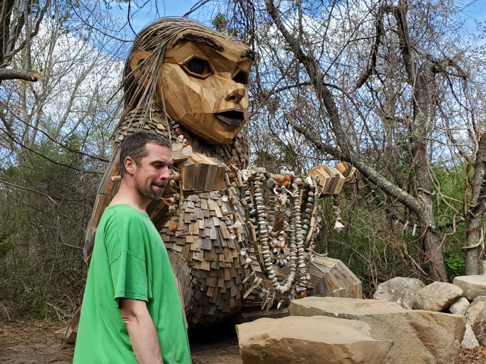 Artist Thomas Dambo with his second troll in Ninigret Park, Greta Granite.