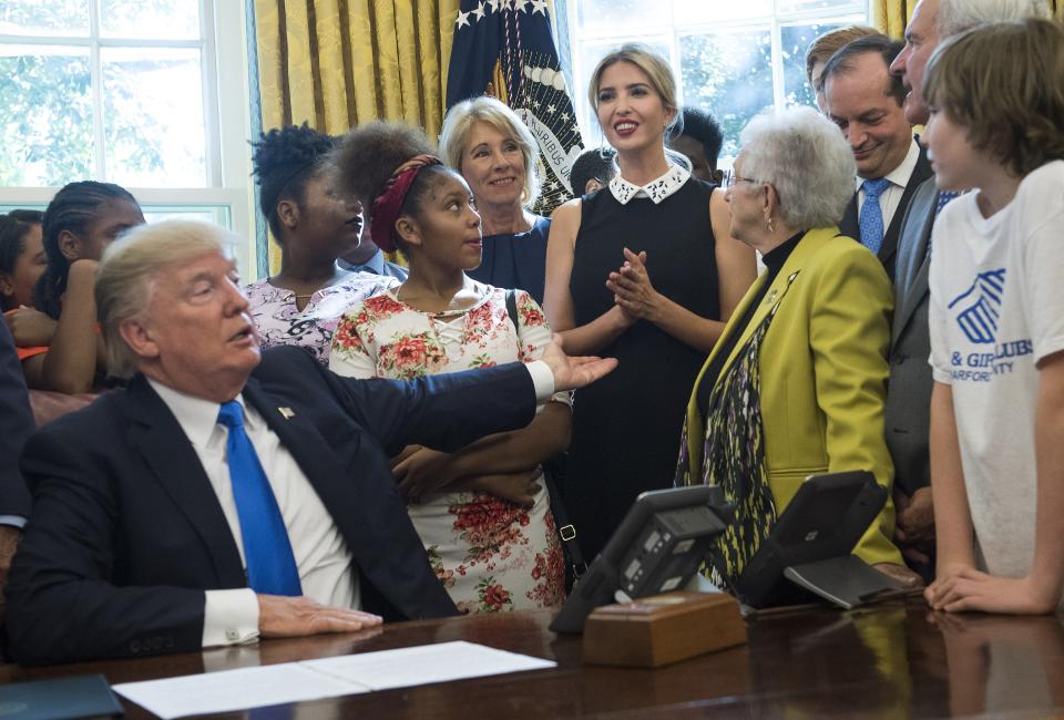 U.S. President Donald Trump motions to his daughter Ivanka Trump as she delivers remarks alongside students and members of congress and her father’s administration, before President Trump signed a memorandum to expand access to STEM (science, technology, engineering and math) education in the Oval Office at the White House on September 25, 2017 in Washington, D.C. (Photo by Kevin Dietsch-Pool/Getty Images)