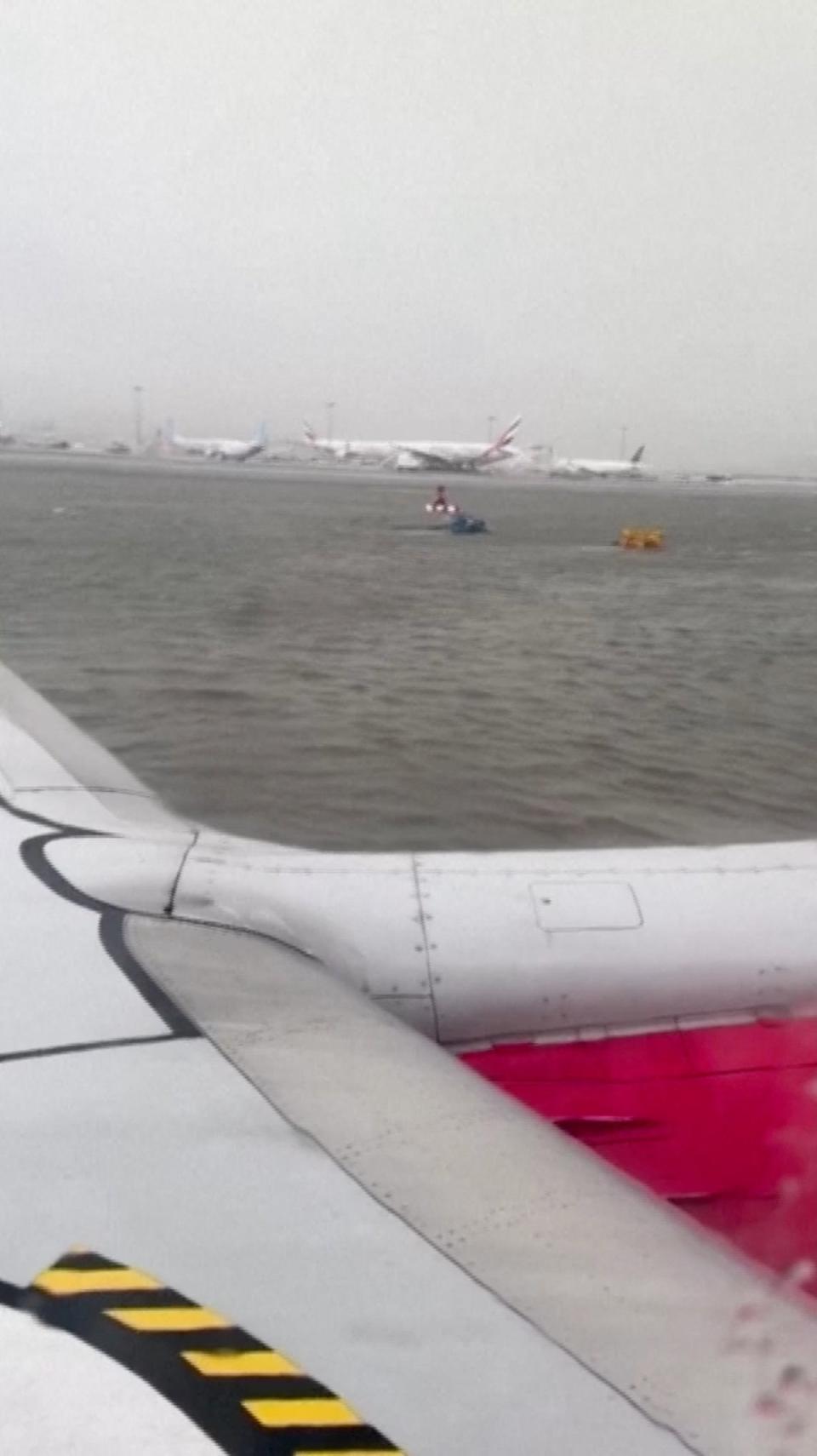 The Dubai international runway was left looking like an ocean (Zaheer Kunnath via REUTERS)