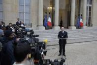 French Interior Minister Bernard Cazeneuve delivers a statement in the courtyard of the Elysee Palace in Paris, France, November 14, 2015, after an extraordinary ministers' meeting, the day after a series of deadly attacks in Paris. REUTERS/Philippe Wojazer