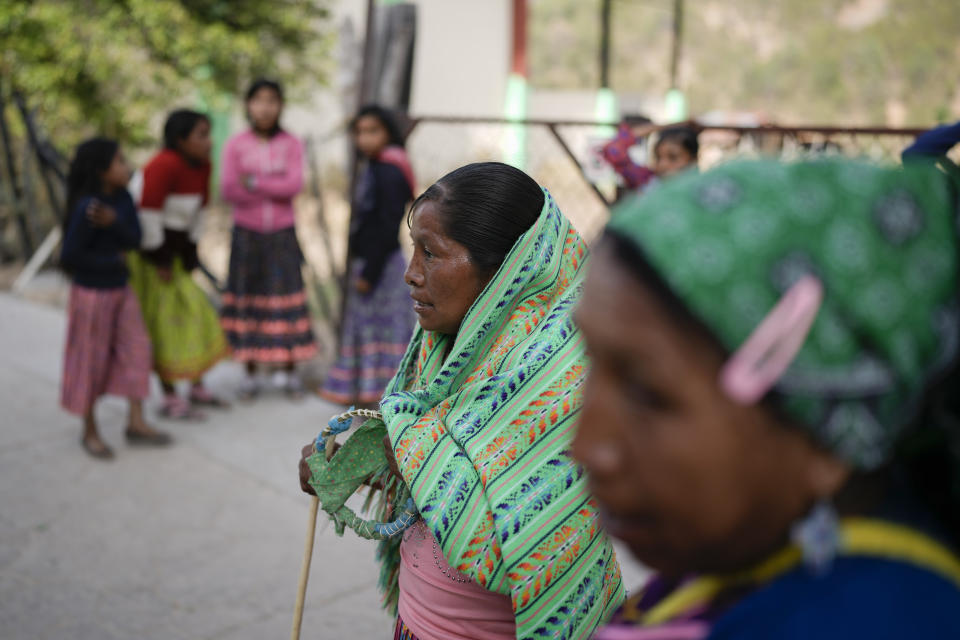 Rarámuri runner Teresa Sánchez rests after she and her team won the Arihueta race in Cuiteco, Mexico, Saturday, May 11, 2024. Sánchez's mother, also a runner, inspired her as a child, but she achieved speed and resistance by working her land. “By walking through the mountain, taking care of the crops and watching my goats,” she said. (AP Photo/Eduardo Verdugo)