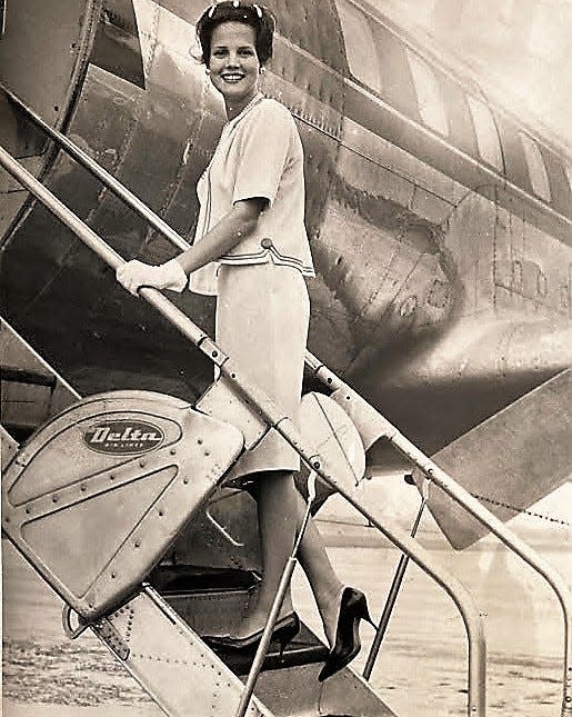 Augusta's Vivian Davis boards a Delta flight for New York and the 1964 Miss America Pageant.