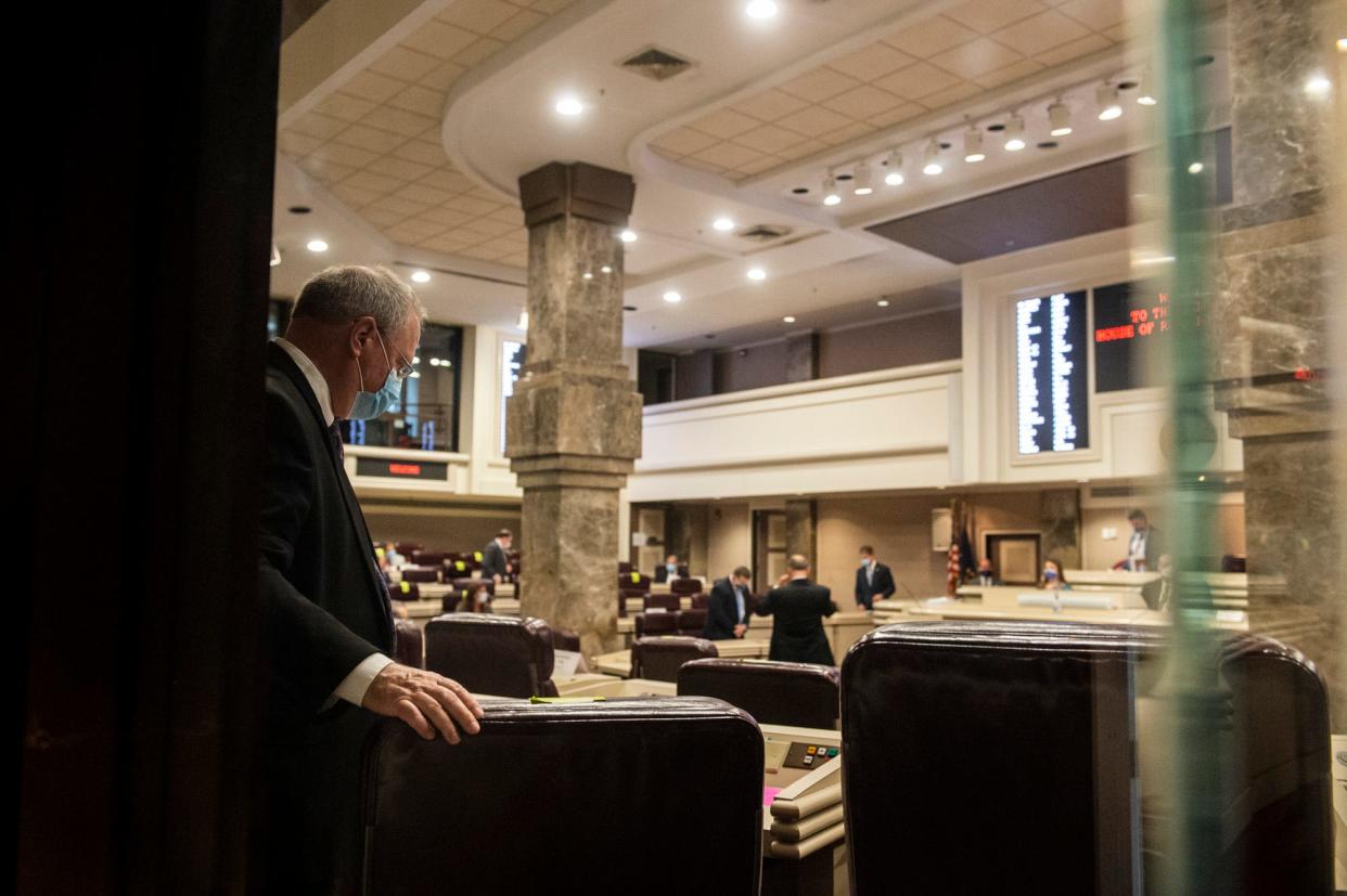 Representatives find their seats as the Alabama House of Representatives at the State House in Montgomery, Ala., on Monday, May 4, 2020.