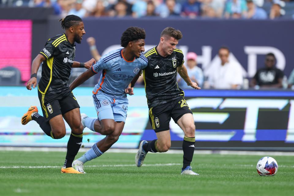 Jun 17, 2023; New York, New York, USA; Columbus Crew defender Steven Moreira (31) and midfielder Sean Zawadzki (25) battle New York City FC forward Talles Magno (43) for the ball during the first half at Yankee Stadium. Mandatory Credit: Vincent Carchietta-USA TODAY Sports