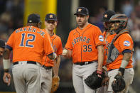 Houston Astros starting pitcher Justin Verlander (35) hands the ball to manager Dusty Baker Jr. (12) as he is pulled during the sixth inning in Game 5 of the baseball American League Championship Series against the Texas Rangers Friday, Oct. 20, 2023, in Arlington, Texas. (AP Photo/Julio Cortez)