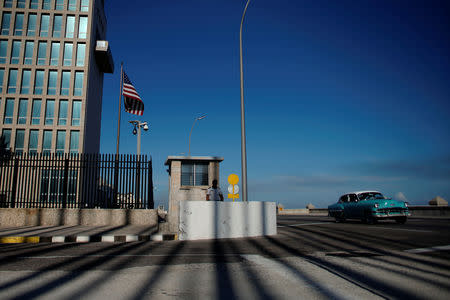 A vintage car passes by the U.S. embassy in Havana, Cuba, March 12, 2019. REUTERS/Alexandre Meneghini