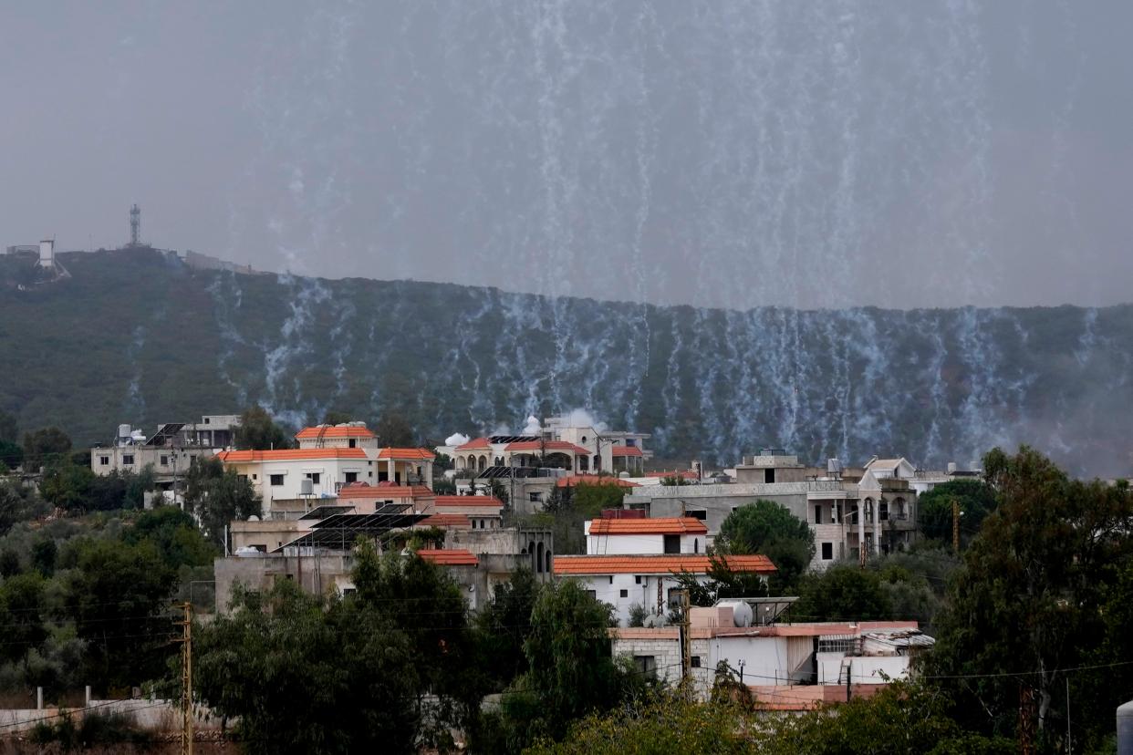 A shell from Israeli artillery explodes over Aita al-Shaab a Lebanese border village with Israel, (AP)