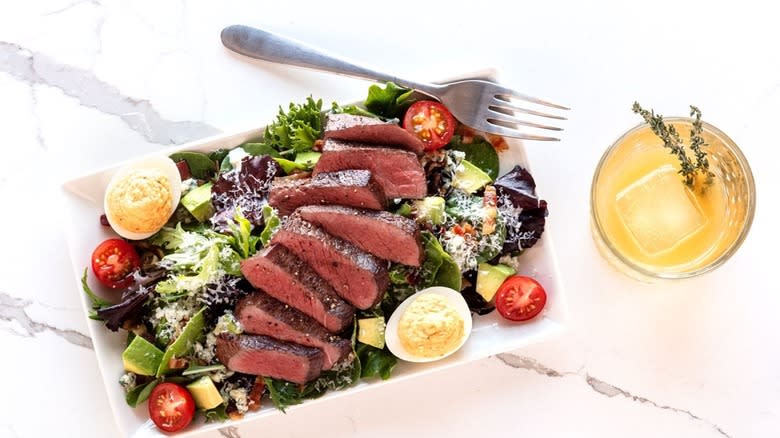 Del Frisco's steak salad on platter