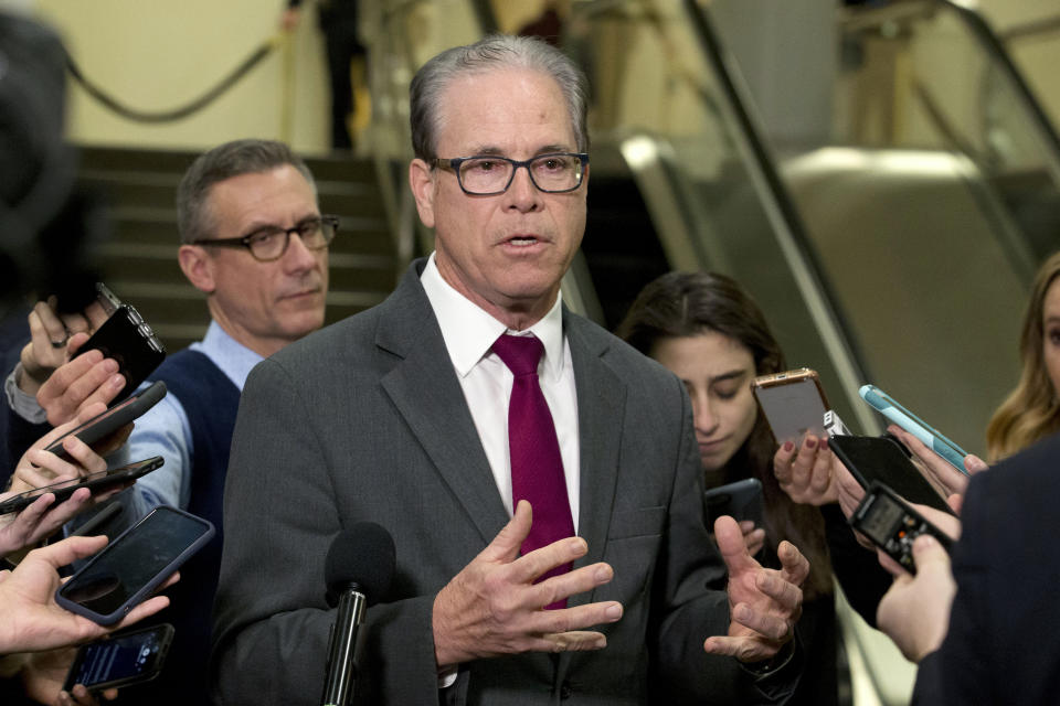 Sen. Mike Braun, R-Ind., speaks to reporters during a recess on Capitol Hill in Washington, Wednesday, Jan. 22, 2020. (AP Photo/Jose Luis Magana)