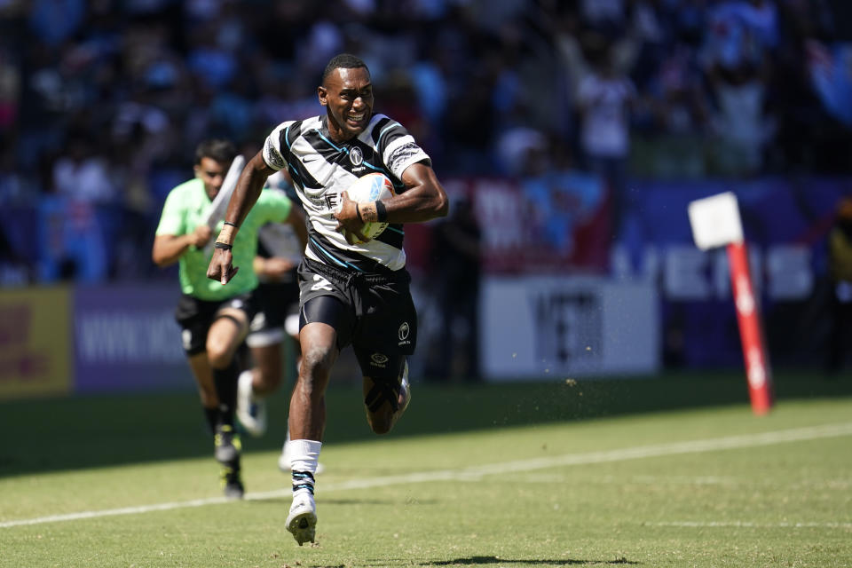 Fiji's Jose Talacolo runs clear to score a try against Australia during their Los Angeles rugby sevens series semifinal match at Dignity Health Sports Park in Carson, Calif., Sunday, 28, Aug. 27, 2022. (AP Photo/Marcio Jose Sanchez)
