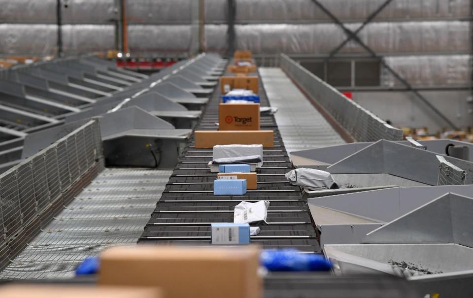 Parcels on a production line at an Australia Post delivery centre